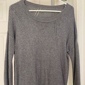 Gray sweater with small hole detailing